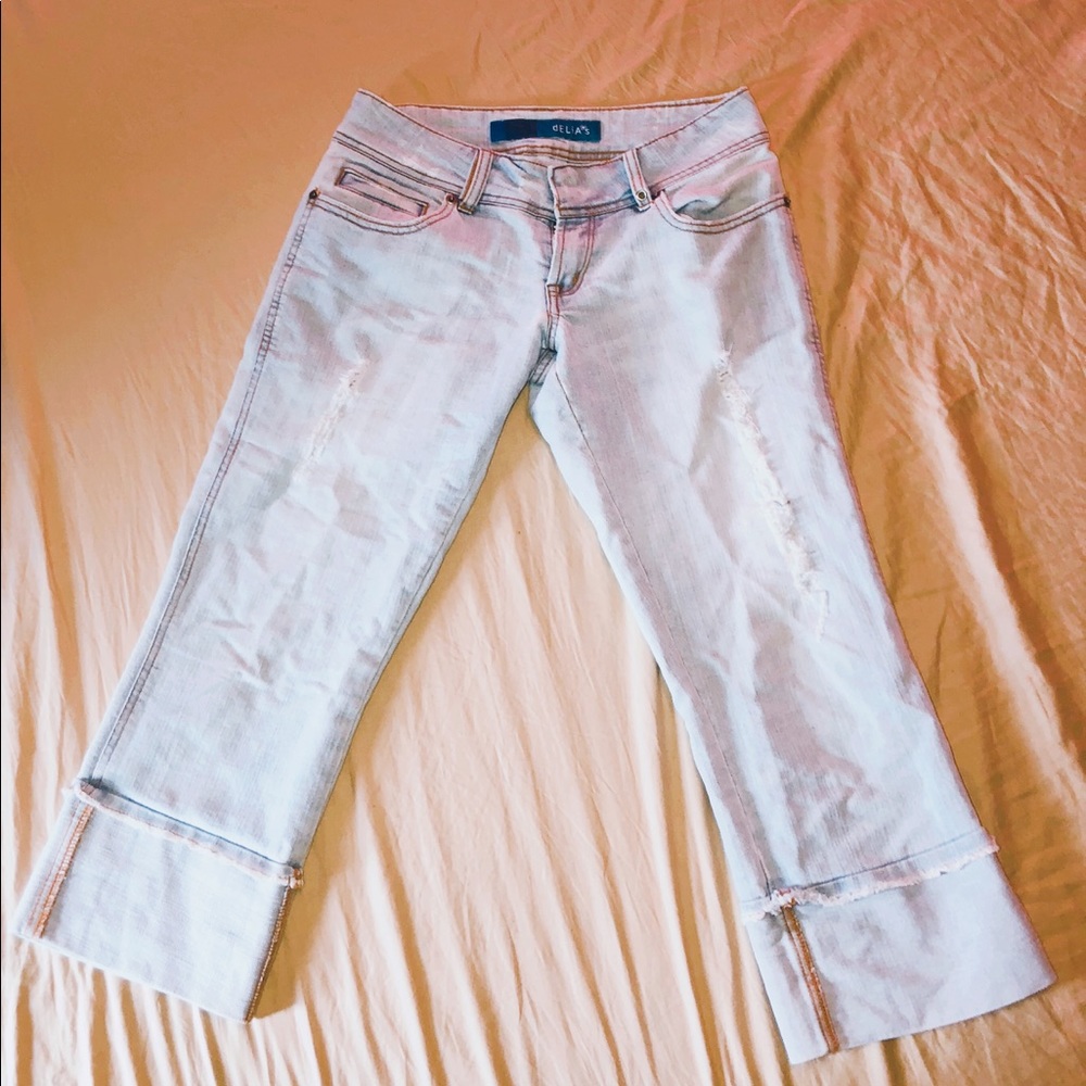 light blue capris with rips on legs